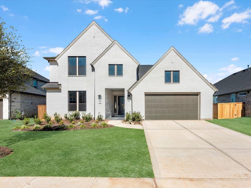 Front exterior of a new home in Brook Bend at Clopton Farms, Montgomery, TX, highlighting curb appeal (Image 1). Front exterior of a new home in Brook Bend at Clopton Farms, Montgomery, TX, highlighting curb appeal (Image 1).