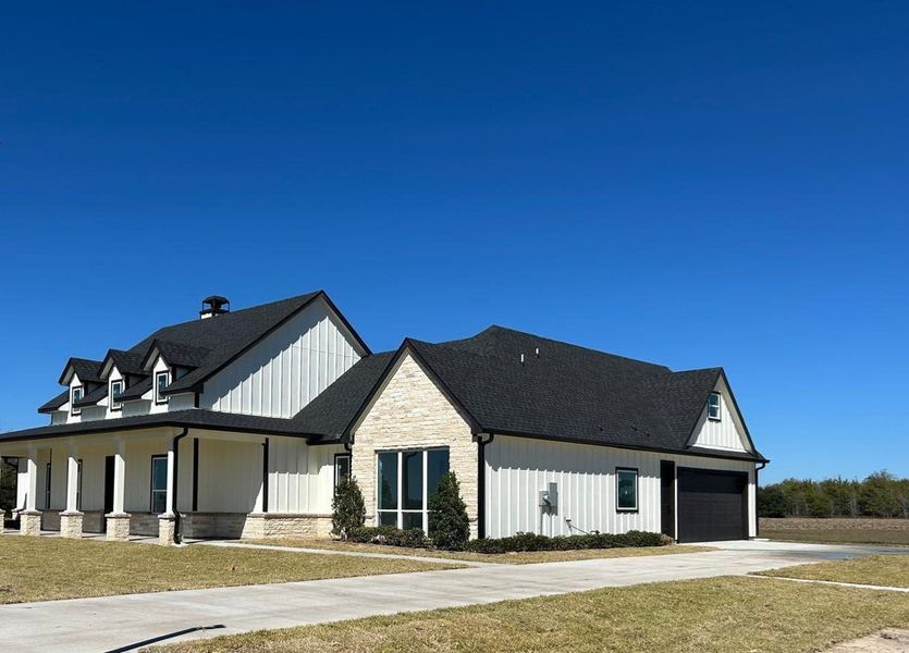 Front exterior of a new home in , Sealy, TX, highlighting curb appeal (Image 16). Front exterior of a new home in , Sealy, TX, highlighting curb appeal (Image 16).