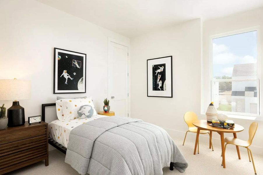 Carpeted bedroom with baseboards