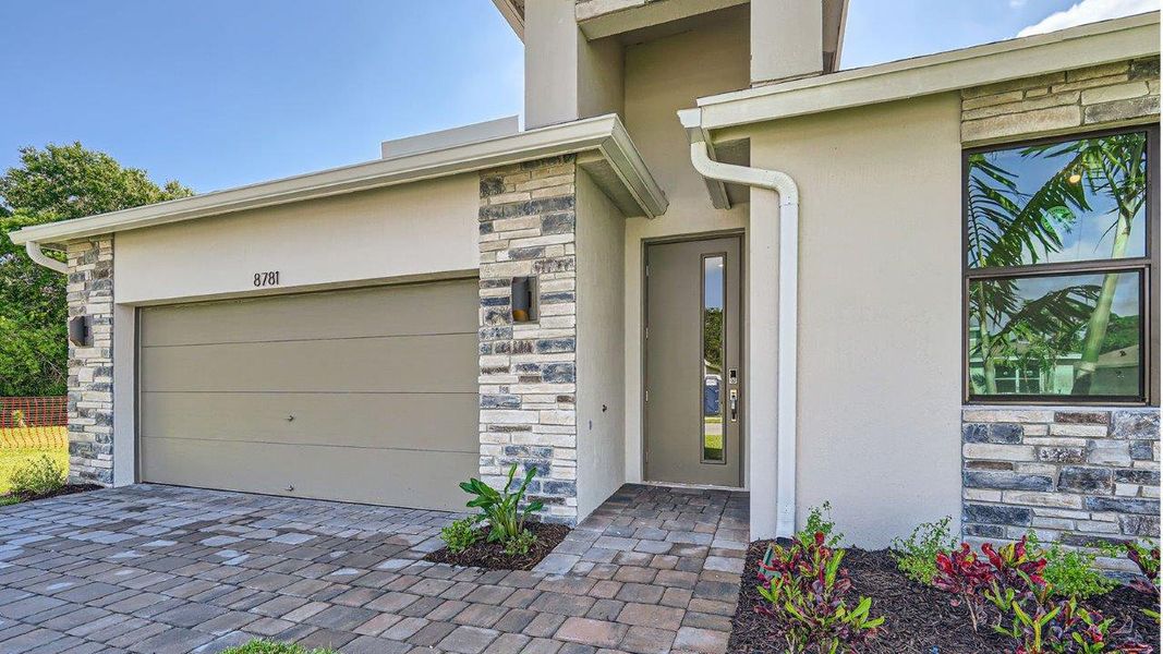 Representative exterior photo of a completed home built from the Cali by D.R. Horton in Twin Oaks, Stuart, FL (Image 16).