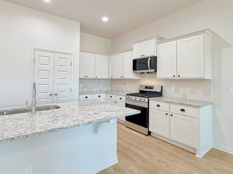 Furnished interior view inside a new home in TerraVista, Victoria (Image 9).