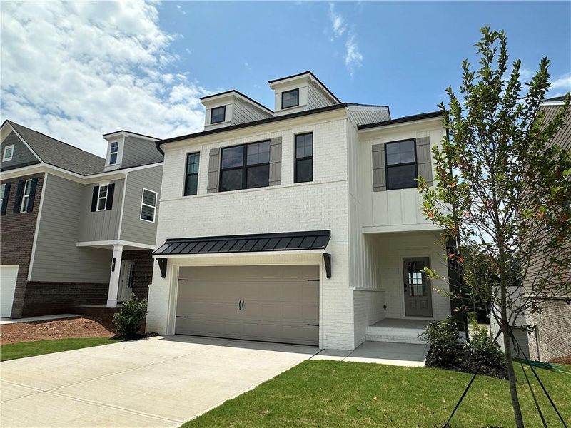 Front exterior of a new home in Kentmere, Auburn, GA, highlighting curb appeal (Image 26). Front exterior of a new home in Kentmere, Auburn, GA, highlighting curb appeal (Image 26).