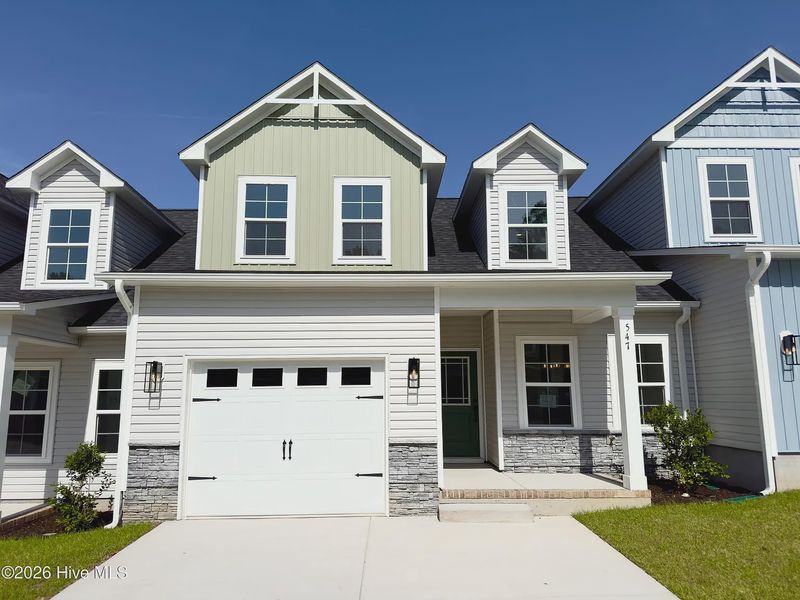 Front exterior of a new home in Autumn Trail, Bolivia, NC, highlighting curb appeal (Image 2). Front exterior of a new home in Autumn Trail, Bolivia, NC, highlighting curb appeal (Image 2).
