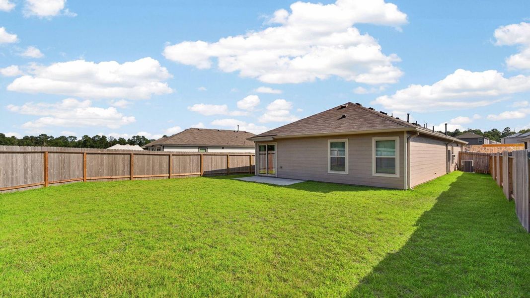 Exterior details and patio area of a home in Caney Mills, Conroe (Image 21).