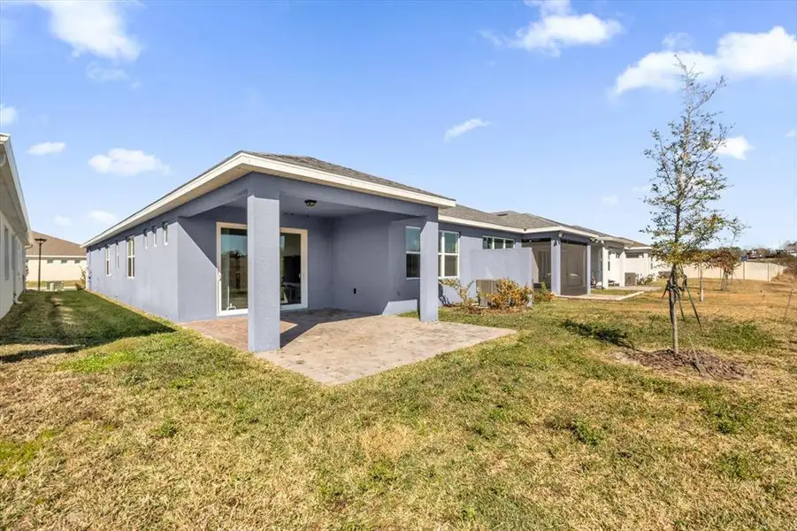 Exterior details and patio area of a home in Tohoqua Reserve, Kissimmee (Image 4).