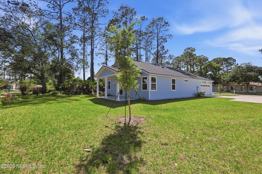Exterior details and patio area of a home in Palm Coast Homes, Palm Coast (Image 32).