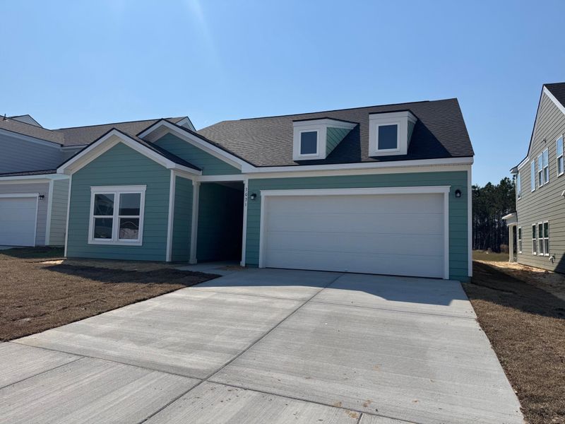 Front exterior of a new home in , Ravenel, SC, highlighting curb appeal (Image 5).