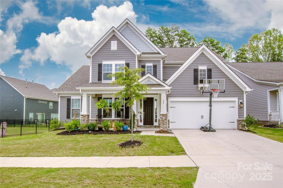Front exterior of a new home in Signature at Reid's Cove, Mooresville, NC, highlighting curb appeal (Image 2).
