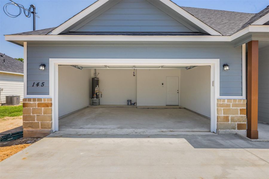 Front exterior of a new home in , Columbus, TX, highlighting curb appeal (Image 22).