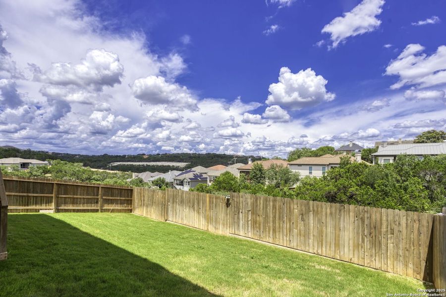 Front exterior of a new home in Canyon View, San Antonio, TX, highlighting curb appeal (Image 24). Front exterior of a new home in Canyon View, San Antonio, TX, highlighting curb appeal (Image 24).