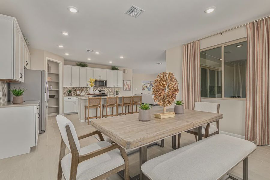 Representative furnished interior of a home built from the 2257 by Elliott Homes in Acacia at Santana, Yuma (Image 12).