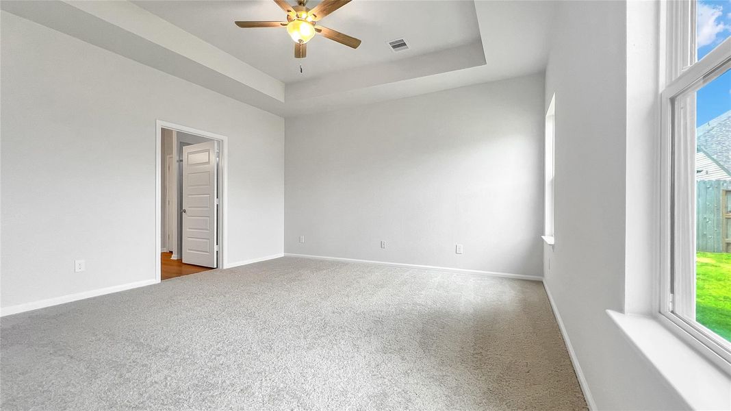 The Pearson- Primary Suite, Tray Ceiling not included. Home under construction. Sample floor plan photo used for illustrative purposes only. Upgrades, selections options, windows and colors may vary.