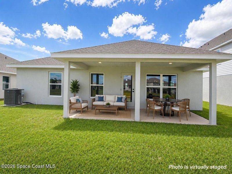 Exterior details and patio area of a home in St. John's Preserve, Palm Bay (Image 15).