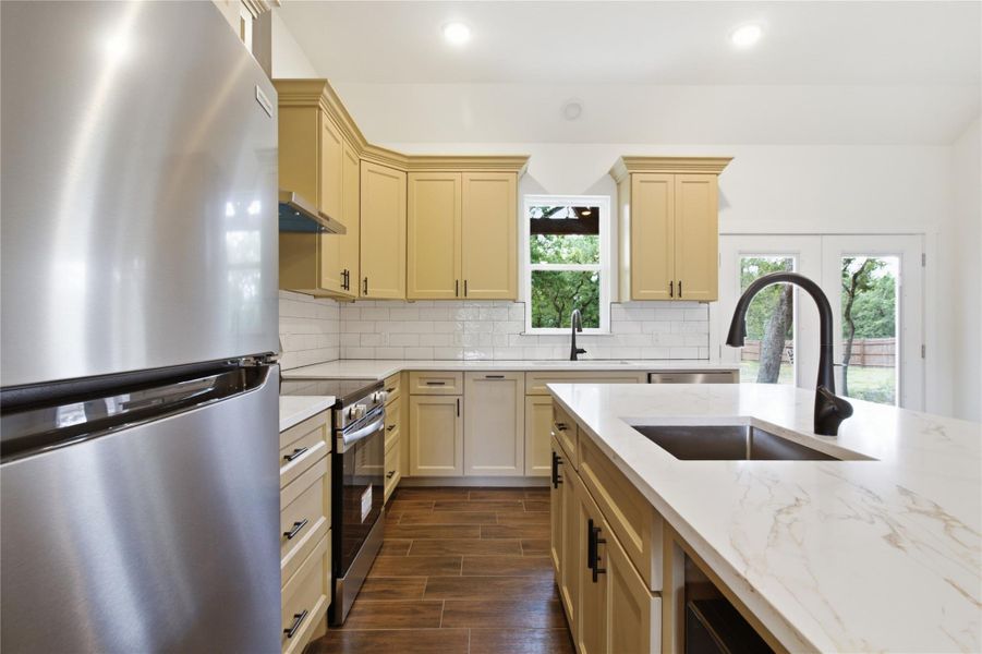 Culinary aspirations find their home in this well-appointed kitchen featuring stainless steel appliances and abundant counter space. Culinary aspirations find their home in this well-appointed kitchen featuring stainless steel appliances and abundant counter space.