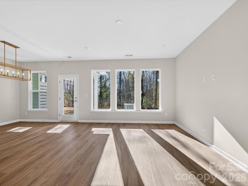 Picture windows allow the home to be filled with natural light while allowing you to enjoy the wooded views of your backyard Picture windows allow the home to be filled with natural light while allowing you to enjoy the wooded views of your backyard