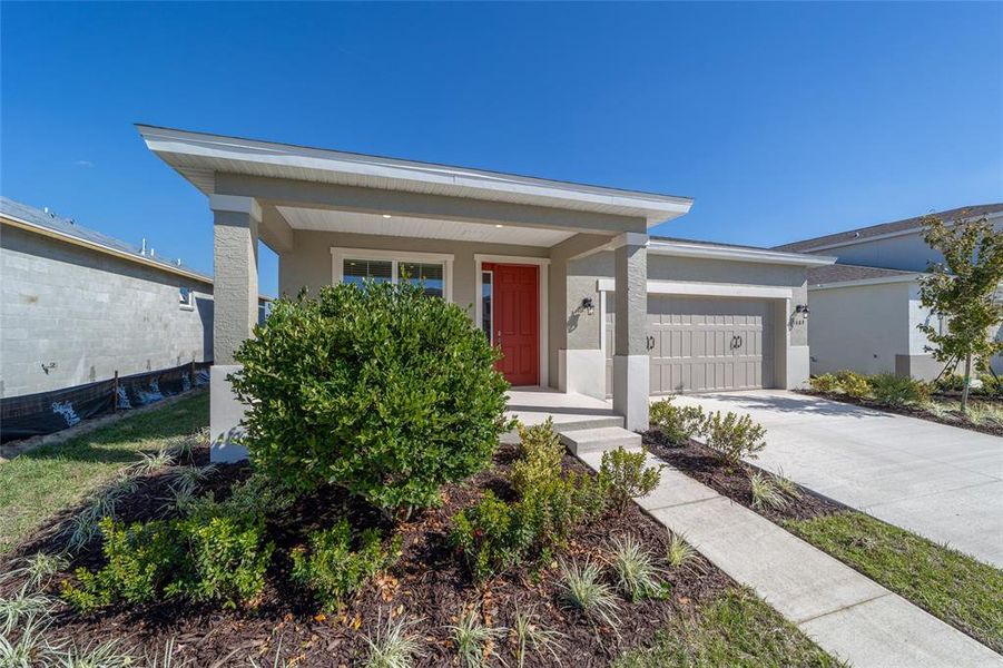Front exterior of a new home in Calesa Township, Ocala, FL, highlighting curb appeal (Image 20).