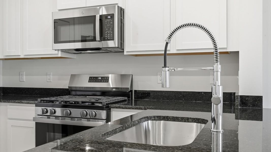 Expansive kitchen offering exceptional workspace and effortless flow to adjacent living areas near Lake Hartwell