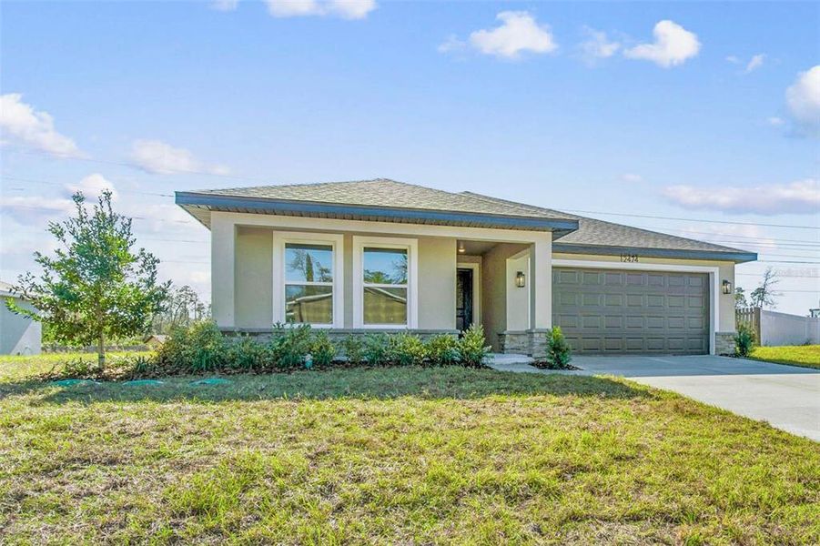 Front exterior of a new home in , Spring Hill, FL, highlighting curb appeal (Image 35).