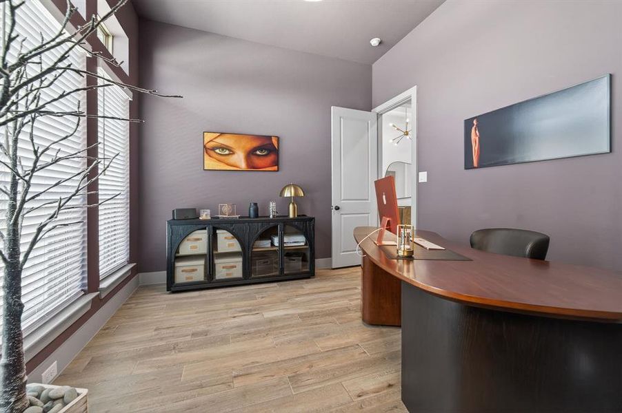 Home office with light wood-type flooring and baseboards Home office with light wood-type flooring and baseboards