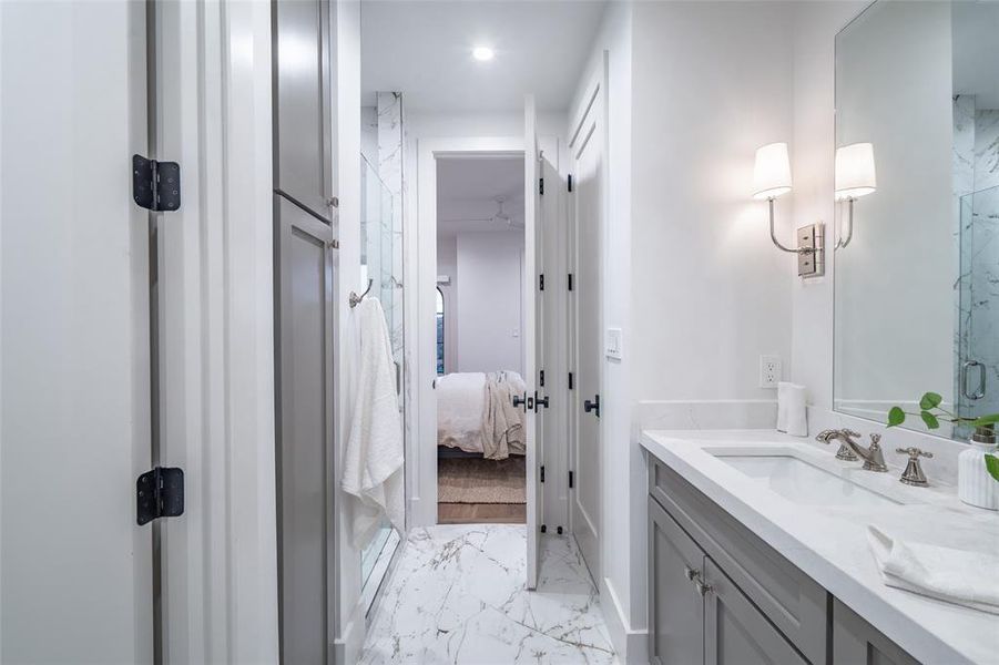 Bathroom featuring vanity and a shower with shower door