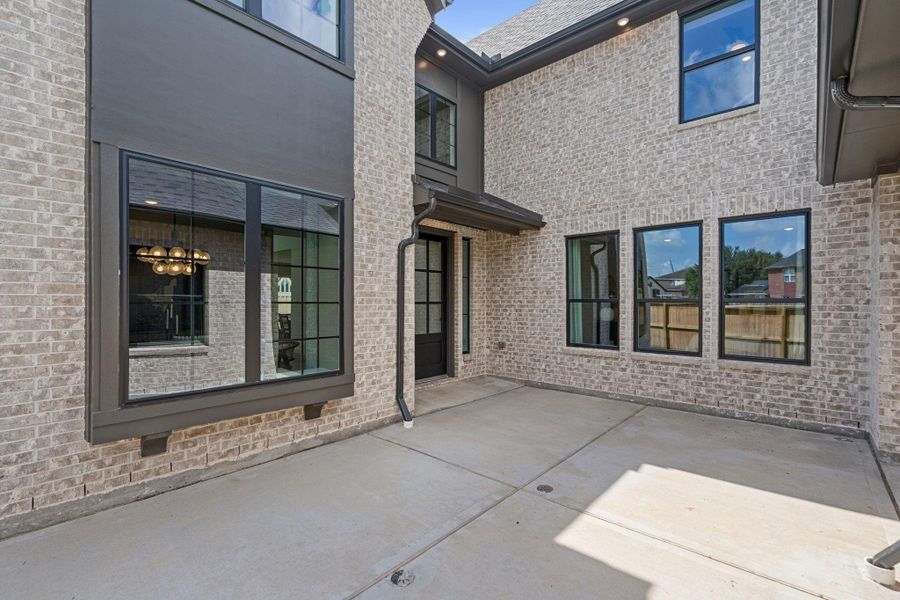 Exterior details and patio area of a home in Sienna Village of Anderson Springs 50', Missouri City (Image 3). Exterior details and patio area of a home in Sienna Village of Anderson Springs 50', Missouri City (Image 3).