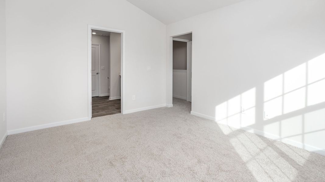 Spacious, unfurnished interior of a new home in The Gables at Edinborough Townes, Gibsonville (Image 14).