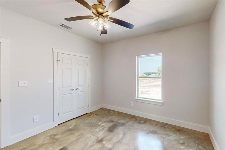 Unfurnished bedroom featuring a closet and ceiling fan