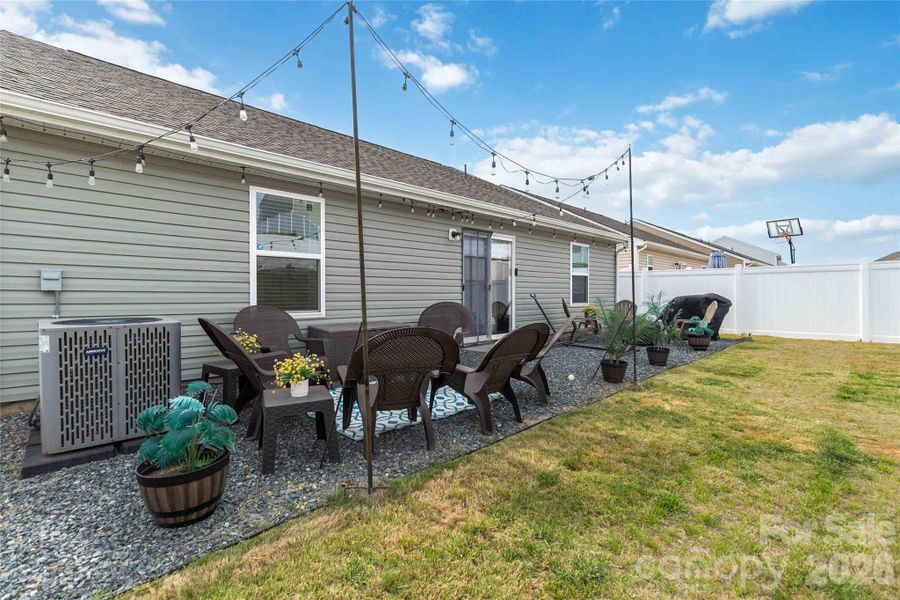 Exterior details and patio area of a home in McKee Creek Village, Charlotte (Image 27).