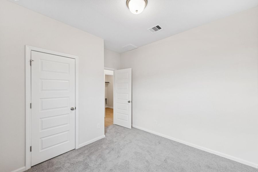 The Cardinal II- Bedroom 2. Photos of home shown are for illustration only; actual features, colors, and upgrades may vary.