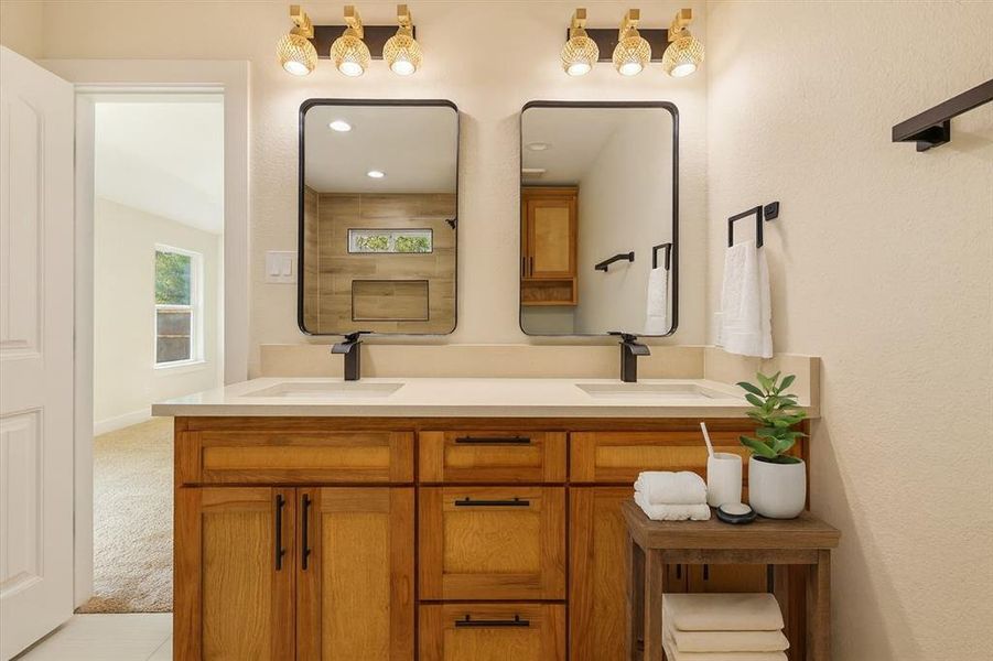 Bathroom featuring double vanity and recessed lighting