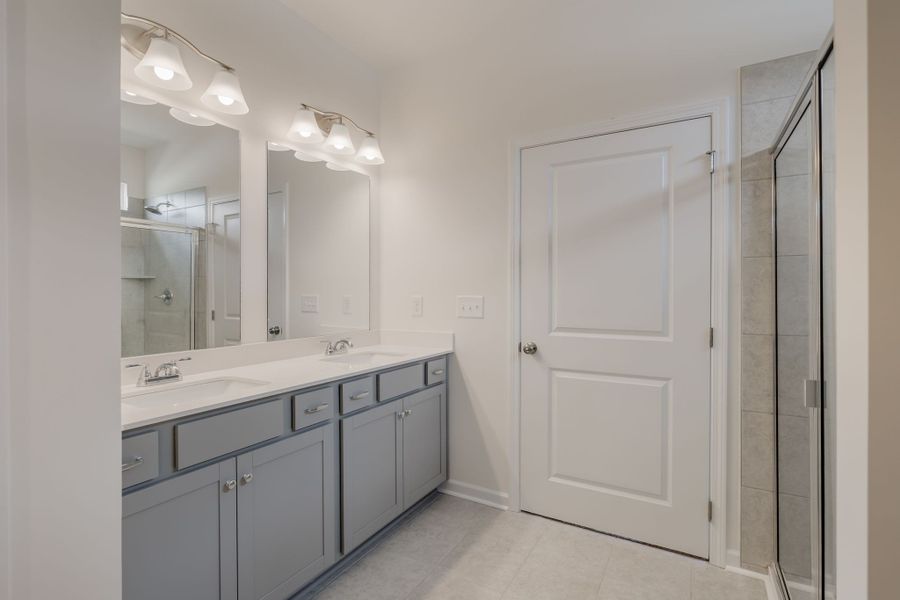Double vanity in the en suite primary bathroom.