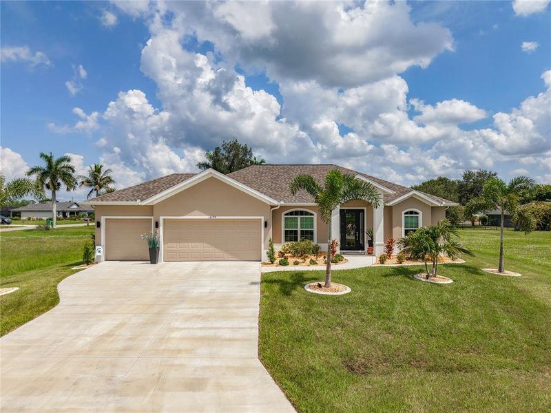 Front exterior of a new home in , Punta Gorda, FL, highlighting curb appeal (Image 22).