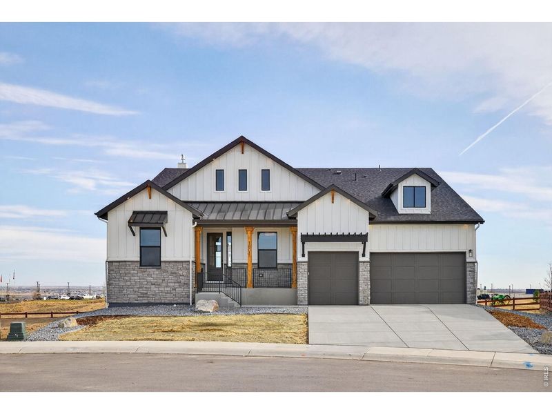 Front exterior of a new home in RainDance, Windsor, CO, highlighting curb appeal (Image 2).