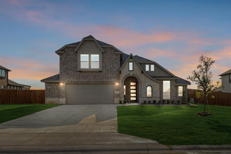 Front exterior of a new home in Coyote Crossing, Godley, TX, highlighting curb appeal (Image 2).
