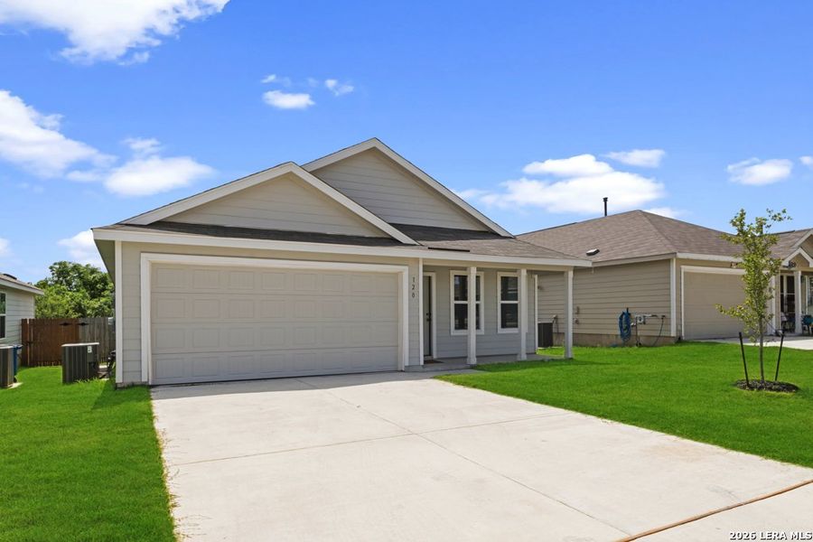 Front exterior of a new home in Lodi Grove, Floresville, TX, highlighting curb appeal (Image 16). Front exterior of a new home in Lodi Grove, Floresville, TX, highlighting curb appeal (Image 16).