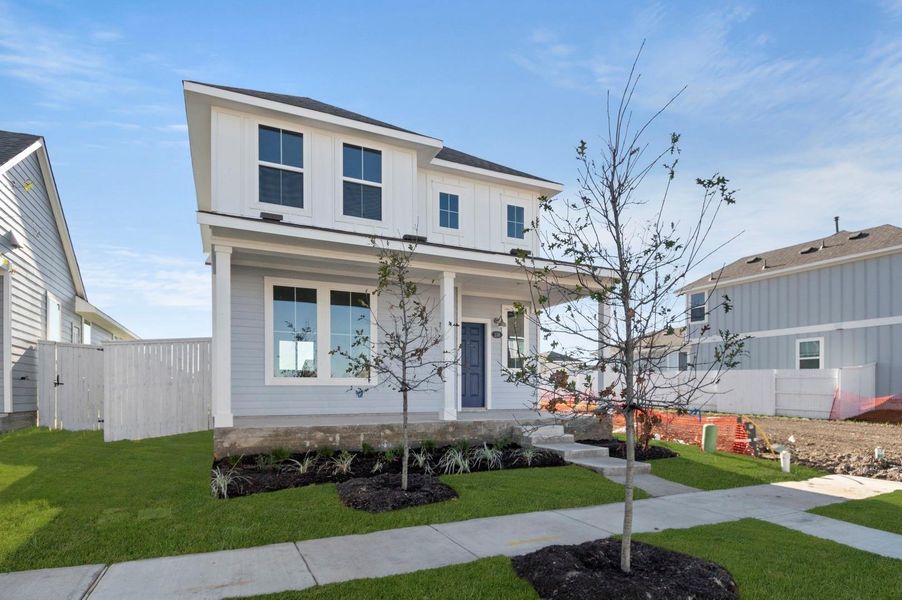 Front exterior of a new home in Harvest Ridge, Elgin, TX, highlighting curb appeal (Image 2). Front exterior of a new home in Harvest Ridge, Elgin, TX, highlighting curb appeal (Image 2).