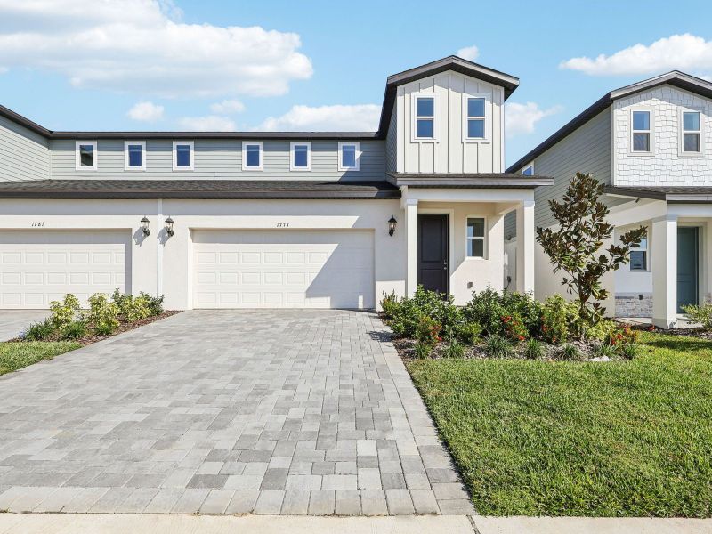 Front exterior of a new home in Cyrene at Minneola - Villas, Minneola, FL, highlighting curb appeal (Image 1). Front exterior of a new home in Cyrene at Minneola - Villas, Minneola, FL, highlighting curb appeal (Image 1).