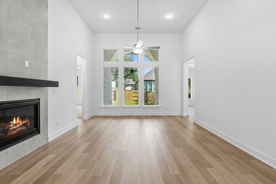 Family Room with soaring ceiling & fireplace Family Room with soaring ceiling & fireplace