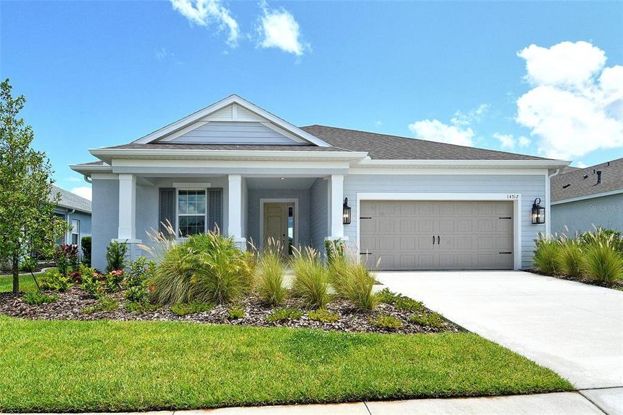 Front exterior of a new home in Canoe Creek, Parrish, FL, highlighting curb appeal (Image 20).