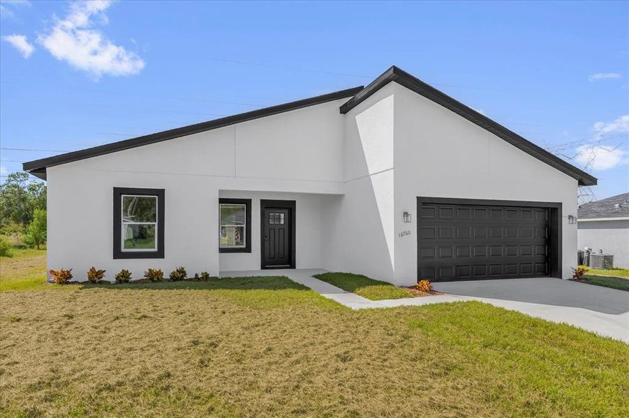 Front exterior of a new home in , Ocala, FL, highlighting curb appeal (Image 1). Front exterior of a new home in , Ocala, FL, highlighting curb appeal (Image 1).