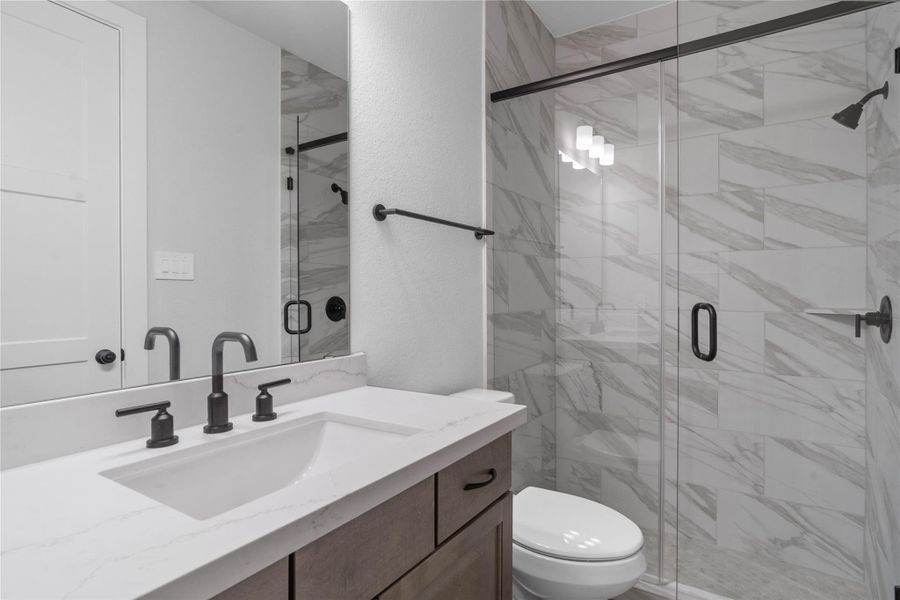 Furnished interior view inside a new home in ARTAVIA, Conroe (Image 12).