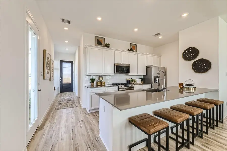 Furnished interior view inside a new home in Bridgeland, Cypress (Image 5).