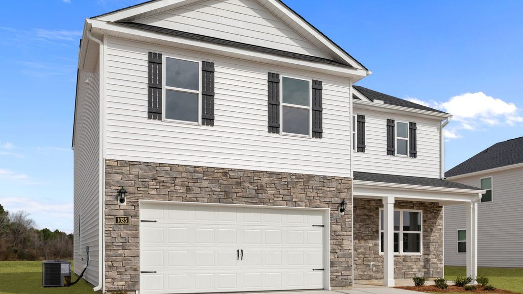 Front exterior of a new home in East Ridge, Ayden, NC, highlighting curb appeal (Image 18). Front exterior of a new home in East Ridge, Ayden, NC, highlighting curb appeal (Image 18).