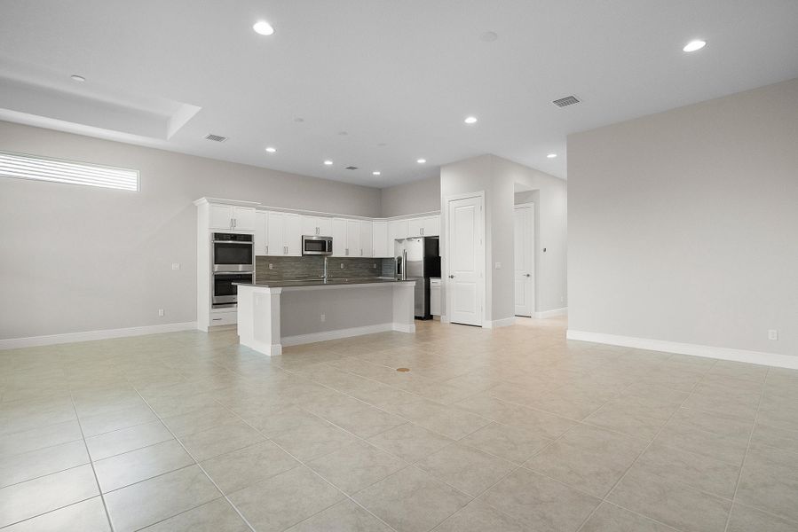 Great Room to Kitchen | 12507 SW Sunrise Lake Terrace