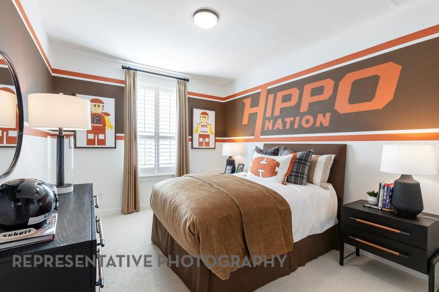 Bedroom featuring carpet floors and baseboards Bedroom featuring carpet floors and baseboards