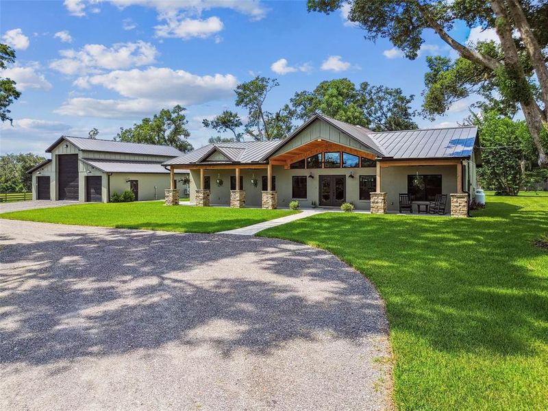 Front exterior of a new home in , Lithia, FL, highlighting curb appeal (Image 27).