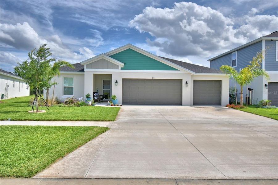 Front exterior of a new home in Harmony at Lake Eloise, Winter Haven, FL, highlighting curb appeal (Image 23).