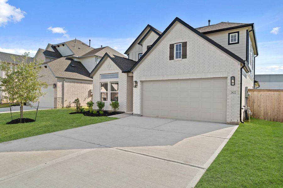 Front exterior of a new home in Morton Creek Ranch, Katy, TX, highlighting curb appeal (Image 2). Front exterior of a new home in Morton Creek Ranch, Katy, TX, highlighting curb appeal (Image 2).