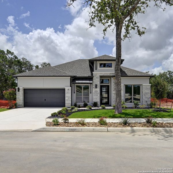 Front exterior of a new home in Esperanza 60', Boerne, TX, highlighting curb appeal (Image 26).