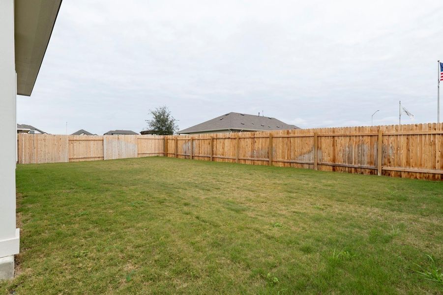 View of fenced backyard